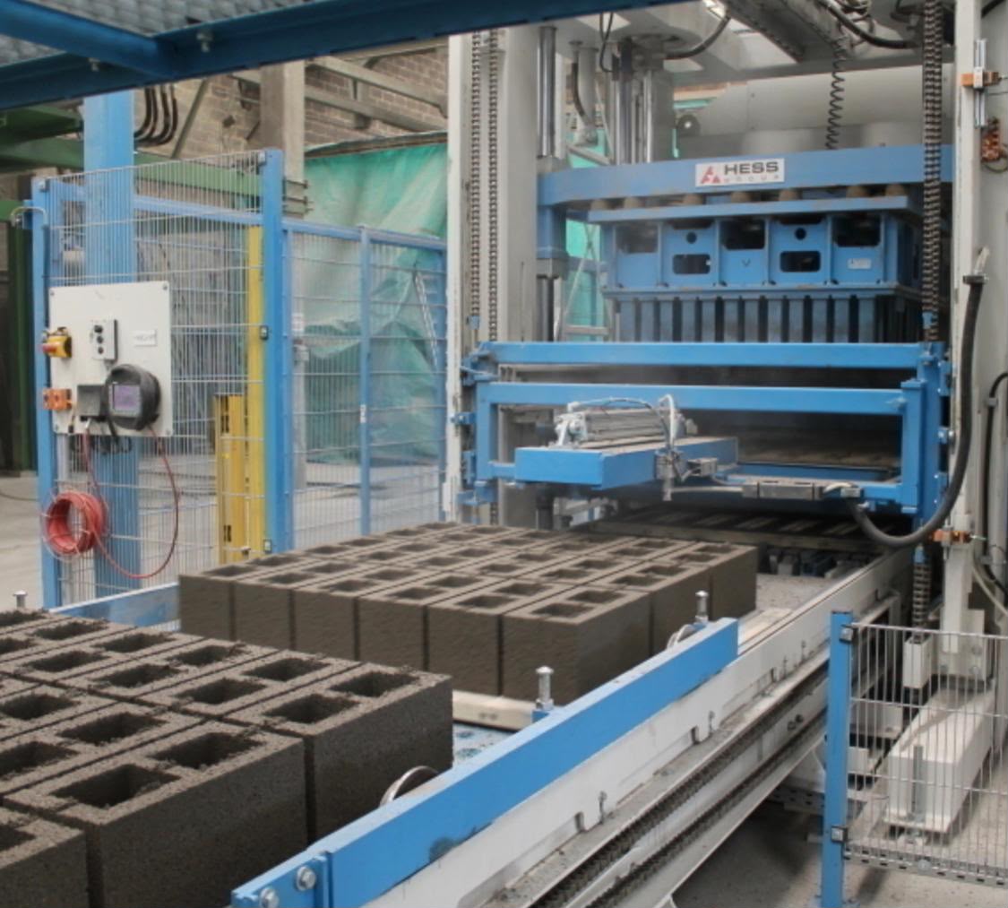 Hollow concrete blocks being manufactured